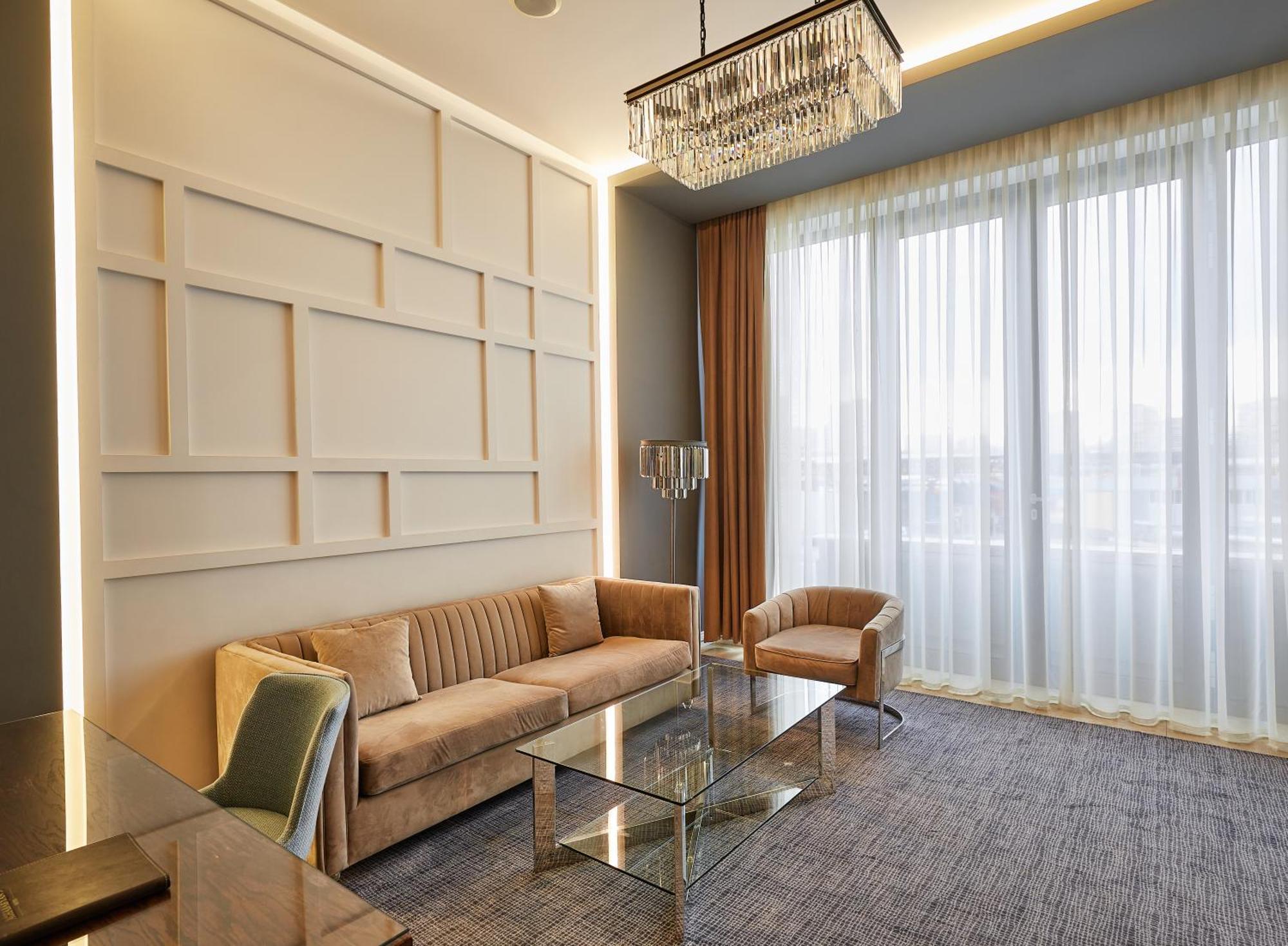 Aghababyan'S Hotel Ereván Exterior foto A living room in a suite at the hotel